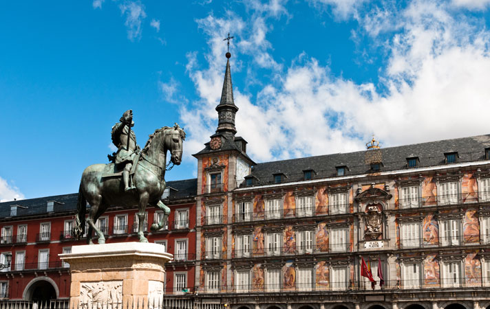 The equestrian bronze statue of King Philip III riding his horse standing prominently in the middle of Plaza Mayor, Madrid.